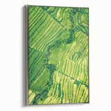 Framed canvas of a vintage-style landscape painting depicting spring, with colorful blooms against a black background.
