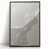 Large abstract wall art depicting a winter scene in muted blue and white tones, framed in black acrylic.