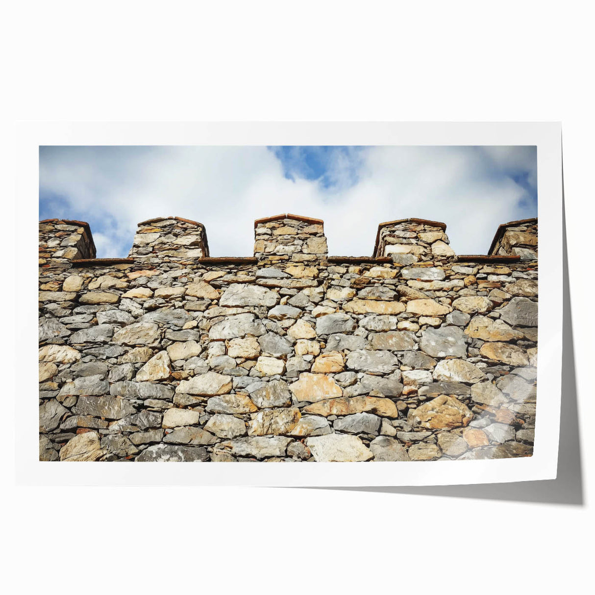 Rolled landscape print showcasing a serene castle scene over rolling hills, featuring vibrant colors and intricate details, packaged securely in a protective tube.