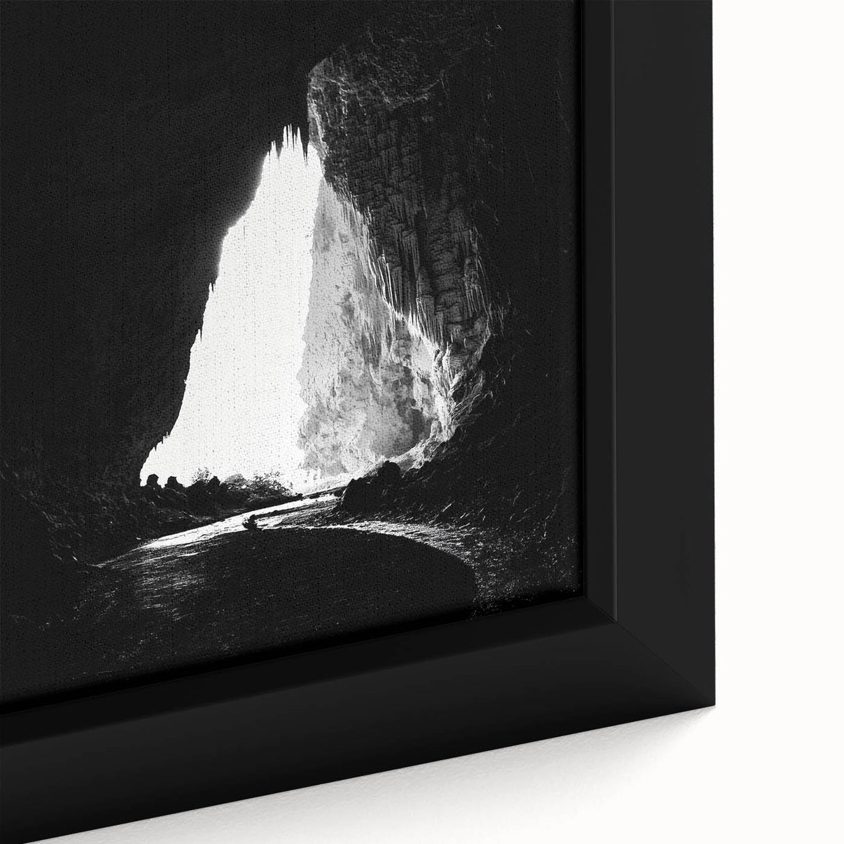 Close-up of a framed canvas artwork showcasing a vibrant landscape with intricate cave formations and earthy tones, perfect for home decor.