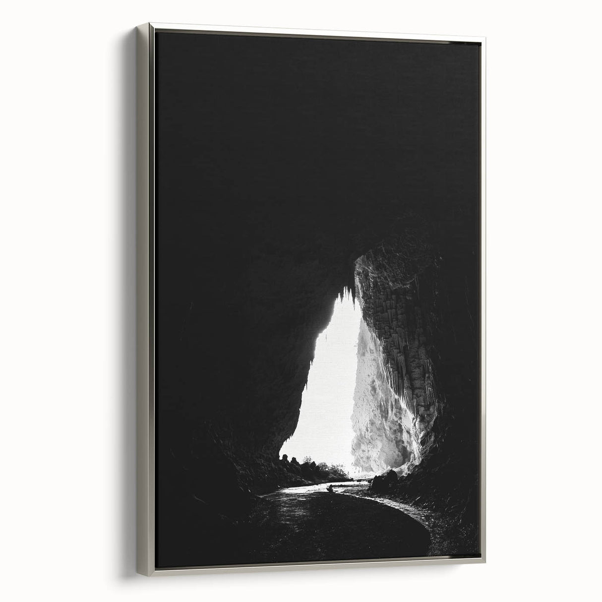 Framed canvas art depicting a serene landscape of caves, showcasing intricate details and a silver frame, ideal for enhancing modern home decor.