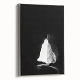 Framed canvas art depicting a serene landscape of caves, showcasing intricate details and a silver frame, ideal for enhancing modern home decor.