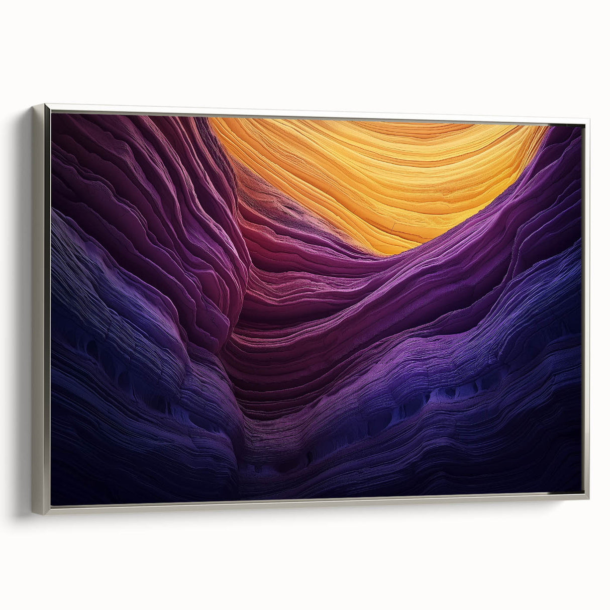 Framed canvas artwork depicting vibrant canyons in a landscape setting, featuring a sleek silver frame that enhances the colors and depth of the scene. This piece adds a modern artistic touch to any decor.