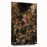 Large abstract wall art depicting autumn trees in warm orange and red tones, printed on acrylic glass.