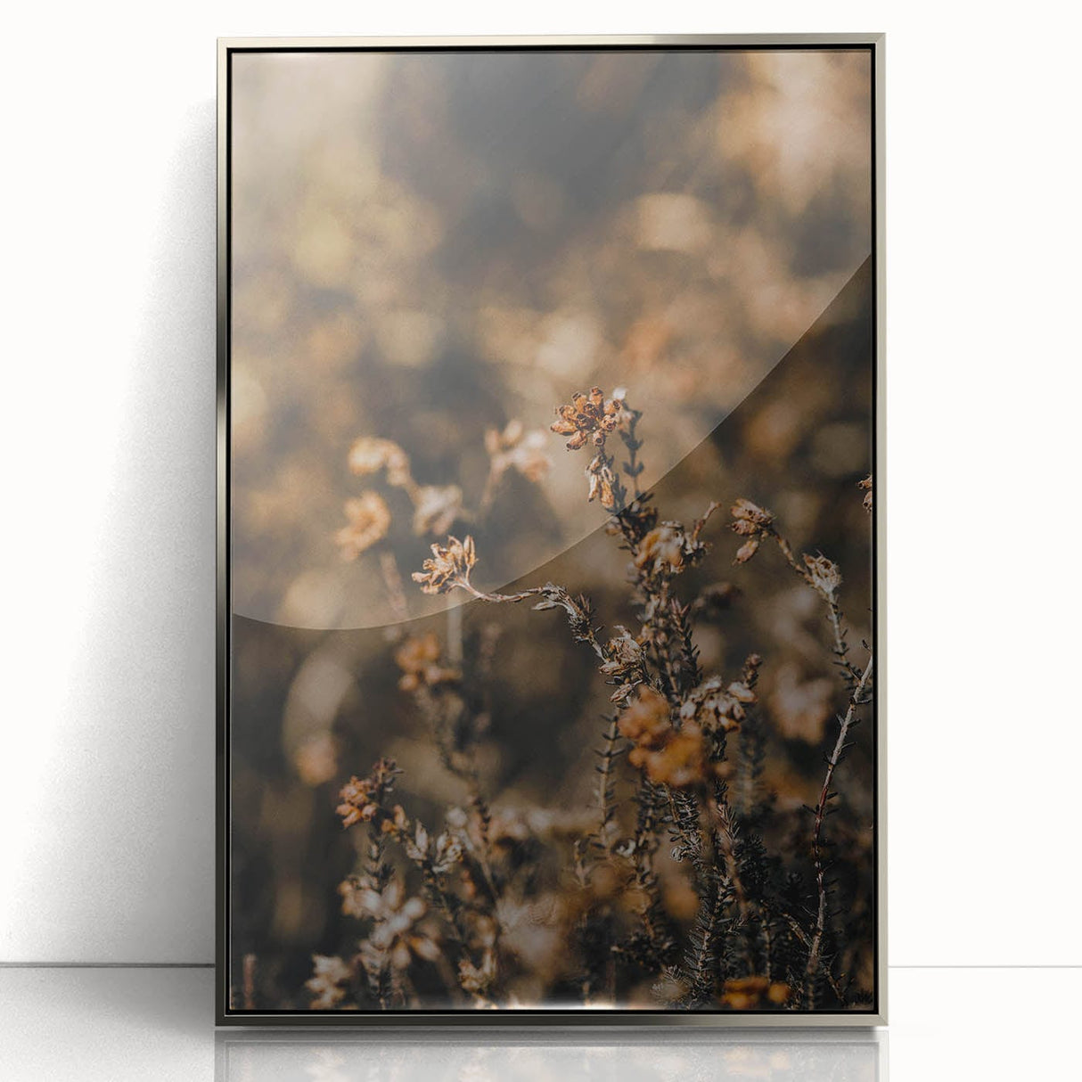 Mid-century modernist art depicting fall trees in orange and brown hues, acrylic print in silver frame.