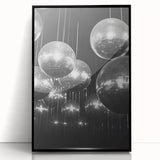 Large abstract wall art featuring swirling blue and white patterns on a black acrylic framed print.