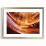 Landscape art print featuring a silver-framed canyon scene with a mat, showcasing rich colors and intricate details, perfect for enhancing home decor.