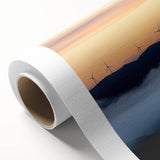 Lush countryside landscape printed on rolled canvas, showcasing vibrant green fields and a clear blue sky, perfect for adding a serene touch to home decor.