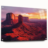 Desert landscape acrylic art piece showcasing vibrant colors with a glass finish, displayed from a side view and secured with pins for stability.