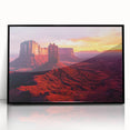 Framed acrylic artwork showcasing a vibrant desert landscape with hues of orange and blue, elegantly displayed with a sleek black frame, perfect for modern decor.