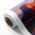 Desert landscape rolled canvas artwork showcasing vibrant orange and warm earth tones, featuring striking canyon formations under a clear blue sky, perfect for home decor.