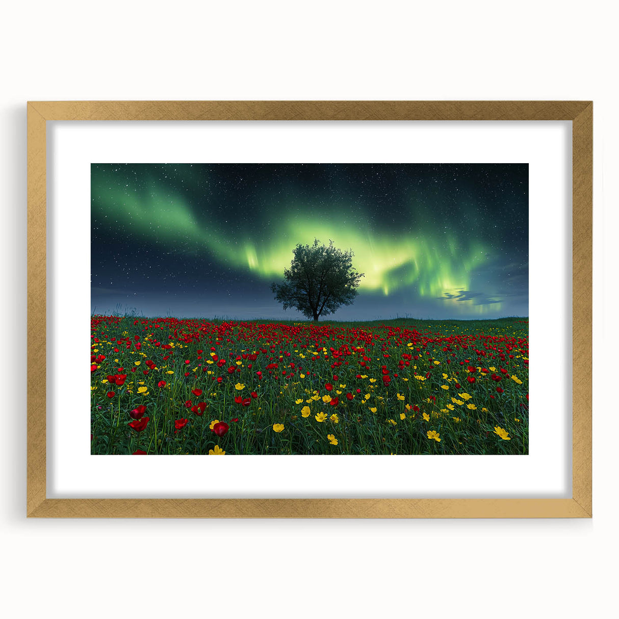 Gold-framed landscape artwork displaying vibrant green fields under a clear blue sky with a white mat border, ideal for home decor or gallery display.