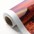 Desert landscape rolled canvas art showcasing vibrant colors and intricate details of sand dunes and a sunset, elegantly packaged in a protective cardboard tube.