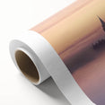 Rolled canvas artwork showcasing a stunning landscape featuring a majestic castle surrounded by lush greenery and vibrant skies, elegantly packaged for safe delivery.