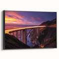 Framed canvas artwork depicting a serene landscape bridge scene with lush greenery and gentle water below, featuring a sleek black frame, ideal for modern decor.