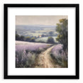 Framed landscape wall art depicting a serene countryside scene with lush green fields and a cloudy sky, featuring a sleek black frame and white matting for an elegant presentation, perfect for home decor.