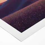 Vibrant rolled canvas artwork showcasing a serene landscape with rolling green fields under a bright blue sky, elegantly packaged in a protective cardboard tube for safe delivery.