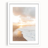 Abstract art print depicting a summer theme in vibrant orange and yellow tones, framed in white.