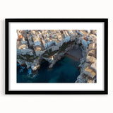 Framed black landscape artwork depicting dramatic cliffs with a mat, showcasing intricate details and textures, perfect for modern home decor.