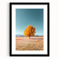 Black-framed landscape art print featuring vibrant fields and lush greenery, set against a neutral mat, enhancing its visual appeal for home decor.