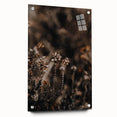 Large abstract wall art depicting autumnal trees on acrylic glass, in warm orange and red tones.