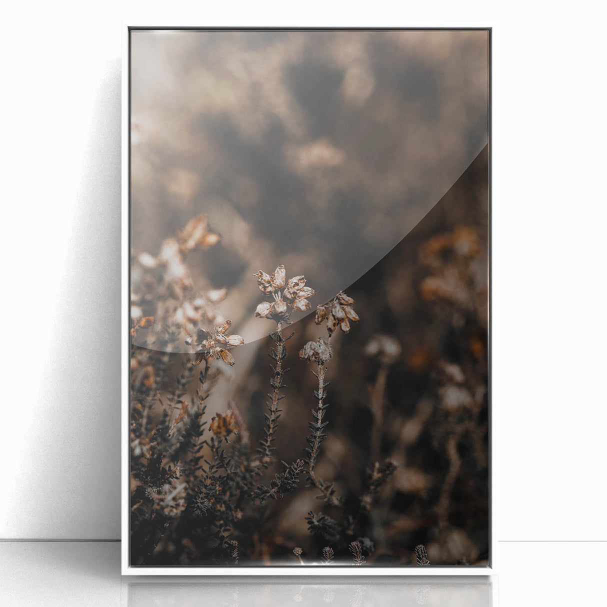 Art Deco poster of autumn leaves in orange and red tones on white acrylic, framed, ideal for nursery wall art.