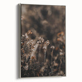 Framed canvas of a vintage landscape painting featuring fall scenery in vibrant orange and red tones.