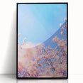 Large abstract wall art featuring swirling blue and green tones on a black acrylic framed print.