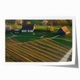 Landscape barn print on textured canvas, showcasing a rustic barn in a serene countryside setting with vibrant green fields and a clear blue sky, rolled for easy display.