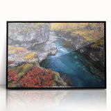 Framed acrylic artwork showcasing a scenic landscape of canyons with rich earthy tones and intricate details, perfect for home decor or office spaces.