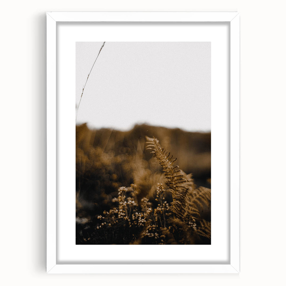 Abstract art print featuring swirling autumnal hues on a white framed canvas, suitable for dining room or bedroom decor.