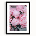 Abstract art print featuring vibrant spring hues on textured canvas, framed in black, ideal for living room decor.