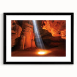 Landscape print featuring canyons framed with a black mat, showcasing earthy tones and textured details, perfect for home decor and nature enthusiasts.