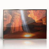 Framed acrylic wall art depicting a vibrant landscape of canyons in rich earthy tones, designed to enhance modern home decor with a sleek silver frame.