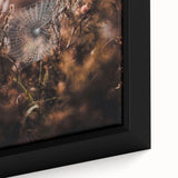 Close-up of a framed canvas featuring textured black wall art with vibrant, colorful autumn-themed elements.
