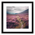 Framed landscape wall art depicting a serene countryside scene, featuring vibrant greens and blues, with a sleek black frame and white matting, perfect for home décor.