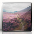 Framed acrylic wall art depicting a serene countryside landscape with vibrant green fields and a clear blue sky, enclosed in a sleek black frame, perfect for home decor.