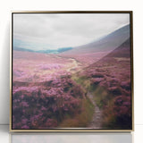Framed acrylic wall art depicting a serene countryside landscape with lush greenery and a vibrant sunset, featuring a gold frame that enhances the artwork's elegance.
