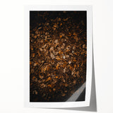 Rolled canvas print featuring an autumnal floral design in warm orange and red tones.