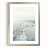 Textured abstract art print in vibrant orange and yellow tones, framed in silver, ideal for bedroom wall decor.