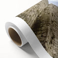 Rolled canvas artwork showcasing a vibrant landscape scene featuring a picturesque castle surrounded by lush greenery, ready for display in a stylish interior setting.