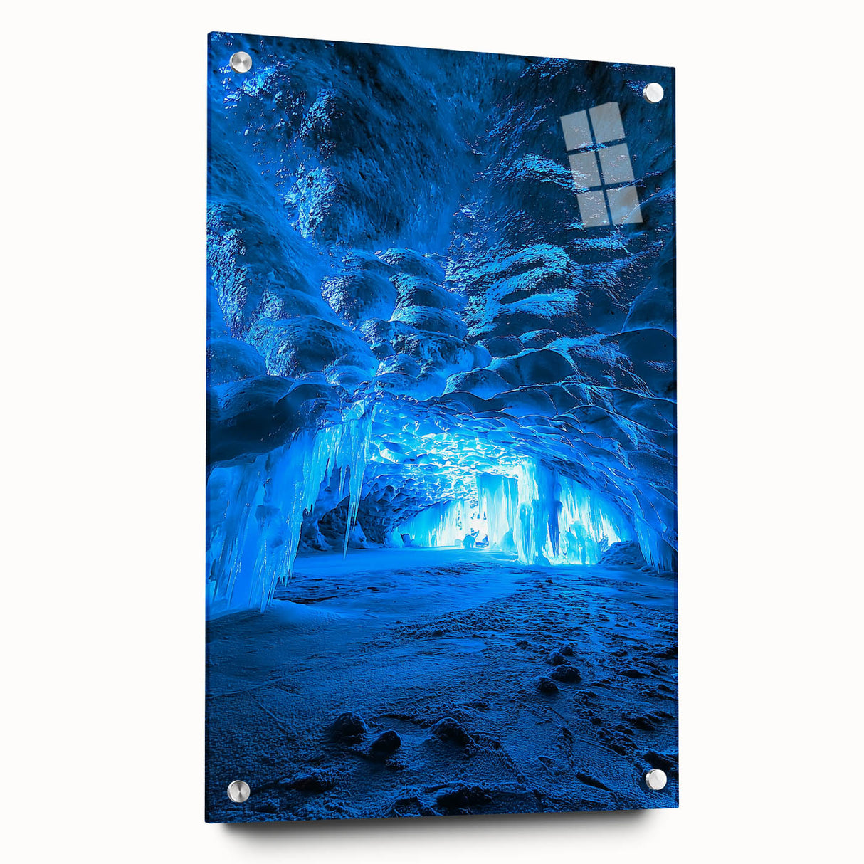 Acrylic glass display of a landscape artwork featuring caves, showcasing vibrant colors and intricate details, secured with stylish pins for an elegant presentation.