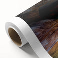 Vibrant rolled canvas artwork showcasing a stunning landscape of canyons in warm earth tones, perfect for home decor or art enthusiasts, packaged securely for delivery.
