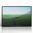 Framed acrylic landscape artwork depicting a serene countryside scene with vibrant colors and intricate details, showcased in a sleek black frame for an elegant finish.