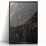 Large abstract wall art depicting autumnal trees in warm orange and red tones, framed in black acrylic.