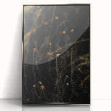 Mid-century modernist art depicting fall trees in vibrant orange and red hues, framed in silver acrylic.