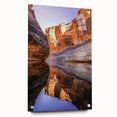 Acrylic glass artwork featuring a vibrant cliff landscape design, displayed from a side view with decorative pins, perfect for modern home decor.