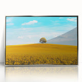 Framed acrylic artwork showcasing a serene countryside landscape with lush greenery and rolling hills, set in an elegant silver frame for a sophisticated decor accent. Ideal for home or office wall art featuring nature's beauty.