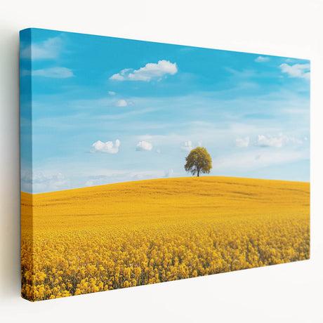 Stretched canvas artwork depicting a serene countryside landscape with rolling hills, vibrant green fields, and a clear blue sky, perfect for home decor.