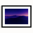Black-framed landscape artwork featuring a desert scene, elegantly matted, showcasing warm earth tones and intricate details for a sophisticated home decor accent.